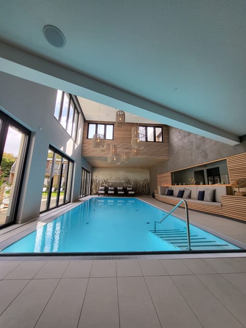 Indoor pool, open 7:00 AM to 8:30 PM, sun loungers