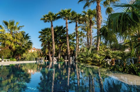 3 outdoor pools, open 9:00 AM to 8:00 PM, pool umbrellas, sun loungers