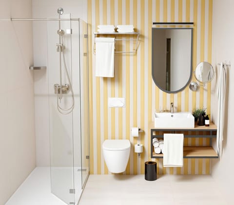 Combined shower/tub, free toiletries, hair dryer, slippers