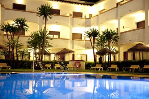 Outdoor pool, open 10:00 AM to 8:00 PM, pool umbrellas, sun loungers