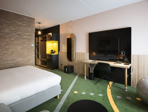 BASE Room | In-room safe, desk, blackout drapes, iron/ironing board