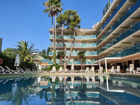 Indoor pool, outdoor pool, open 9:00 AM to 8:00 PM, pool umbrellas