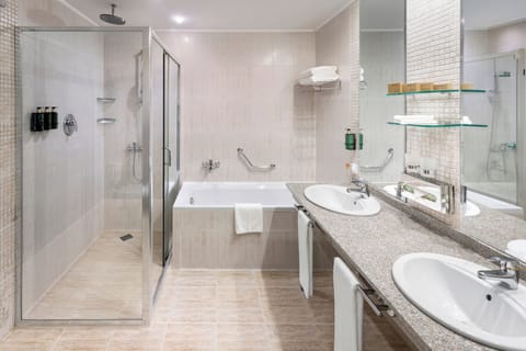 Separate tub and shower, deep soaking tub, eco-friendly toiletries