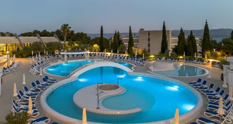 Outdoor pool, open 8 AM to 7 PM, pool umbrellas, sun loungers
