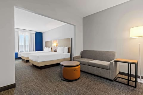 Premium bedding, pillowtop beds, desk, laptop workspace