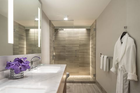 Designer toiletries, hair dryer, bathrobes, slippers