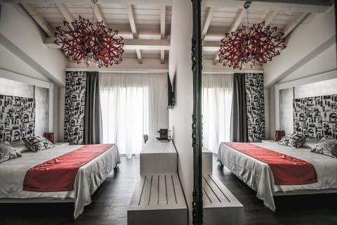 Deluxe Room, Pool View | In-room safe, desk, laptop workspace, soundproofing