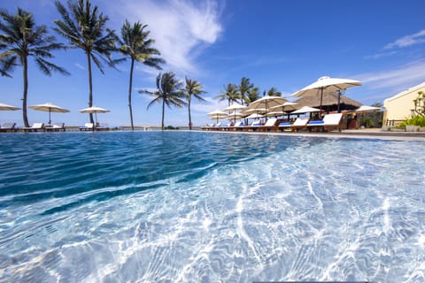 Outdoor pool, open 6 AM to 10 PM, pool umbrellas, sun loungers