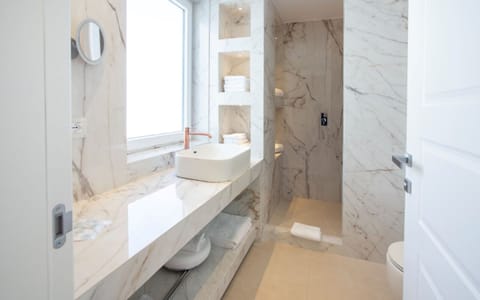 Suite, Terrace, Sea View | Bathroom | Shower, rainfall showerhead, hair dryer, slippers