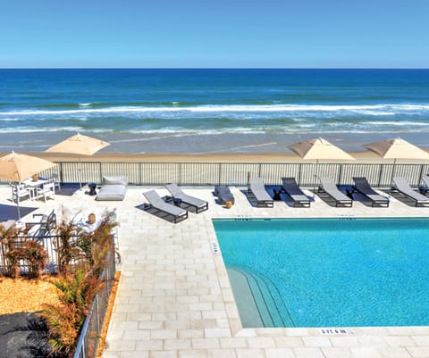On the beach, white sand, beach towels, beach massages