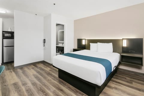 Desk, laptop workspace, blackout drapes, iron/ironing board