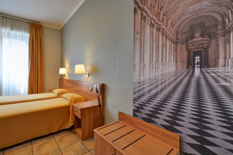 Twin Room | Down comforters, desk, laptop workspace, blackout drapes