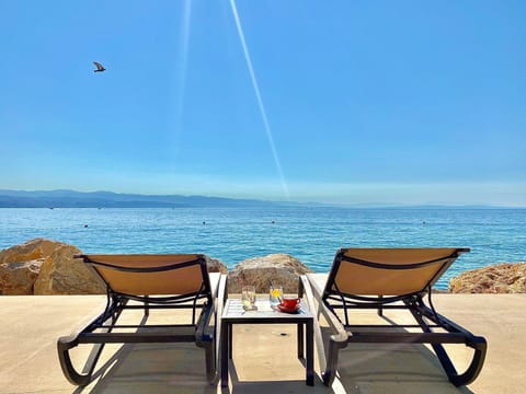 Sun loungers, beach umbrellas, beach towels