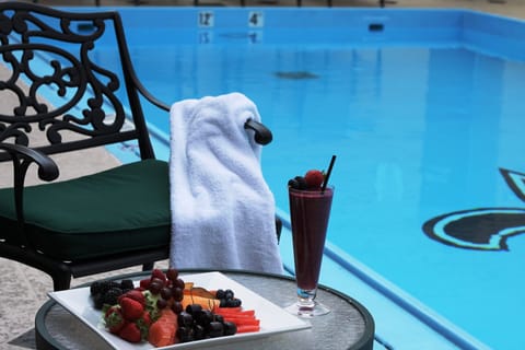 Outdoor pool, open 7:00 AM to 10:00 PM, sun loungers