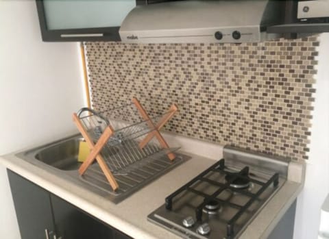 City Apartment, Kitchen | Private kitchenette | Fridge, microwave, stovetop, coffee/tea maker