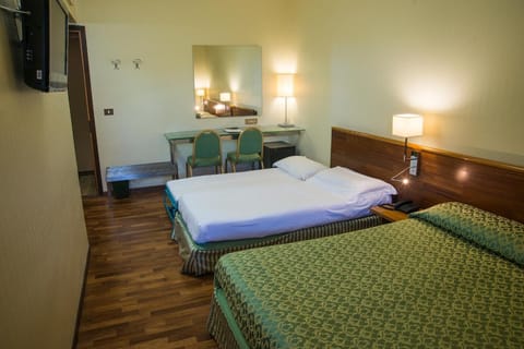 Quadruple Room | Down comforters, minibar, desk, blackout drapes