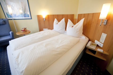 Premium bedding, down comforters, Select Comfort beds, minibar