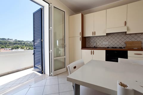 Apartment, 2 Bedrooms | Private kitchen | Full-size fridge, oven, stovetop, cookware/dishes/utensils