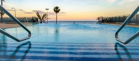 Indoor pool, outdoor pool, pool umbrellas, sun loungers