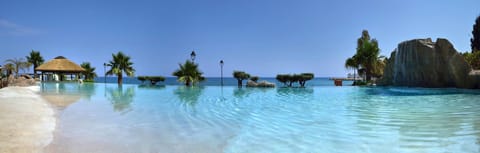 4 outdoor pools, open 10:00 AM to 6:00 PM, sun loungers