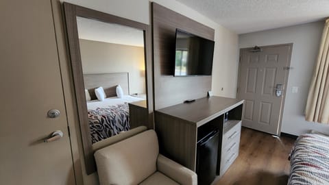 Desk, laptop workspace, blackout drapes, iron/ironing board