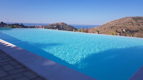Seasonal outdoor pool, pool umbrellas, sun loungers