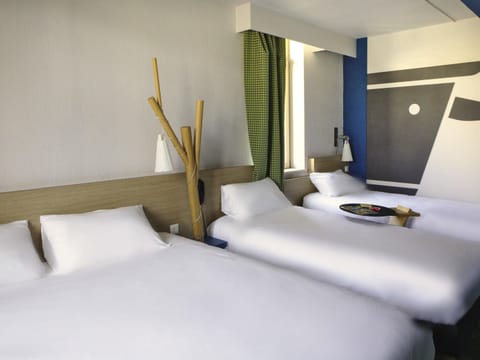 Premium bedding, desk, laptop workspace, blackout drapes