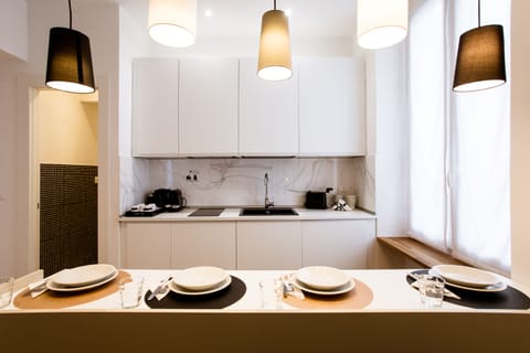 Junior Studio Suite (Via Di Monale 75) | Private kitchen | Coffee/tea maker, electric kettle, dining tables