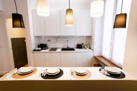 Junior Studio Suite (Via Di Monale 75) | Private kitchen | Coffee/tea maker, electric kettle, dining tables