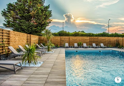 Seasonal outdoor pool, open 8:00 AM to 10:00 PM, pool umbrellas