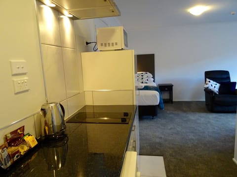 Apartment, 2 Bedrooms | Private kitchen | Fridge, microwave, stovetop, coffee/tea maker