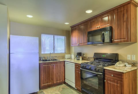 Deluxe Suite, 2 Bedrooms | Private kitchen | Fridge, microwave, coffee/tea maker