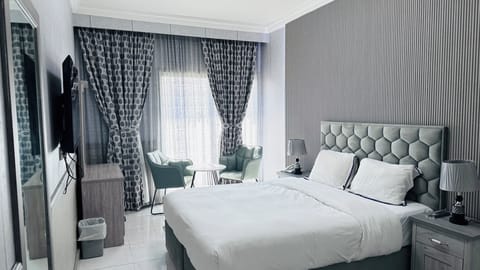 Deluxe Double Room, 1 King Bed | Minibar, in-room safe, desk, laptop workspace