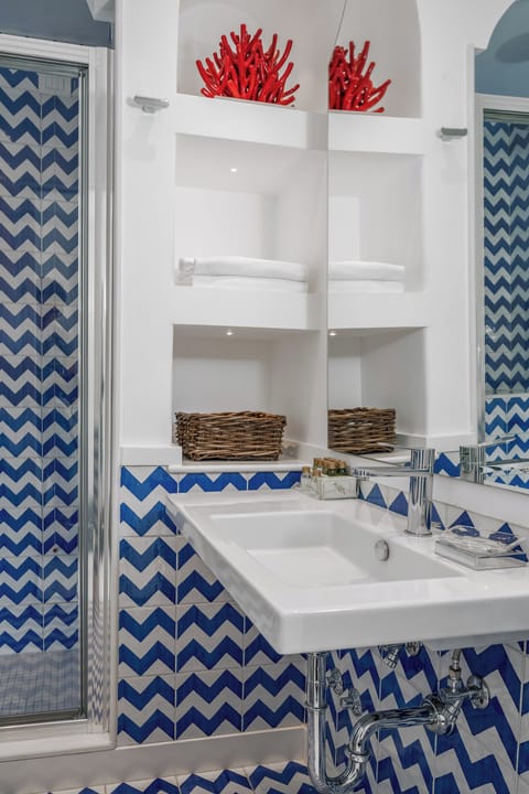 Shower, free toiletries, hair dryer, slippers