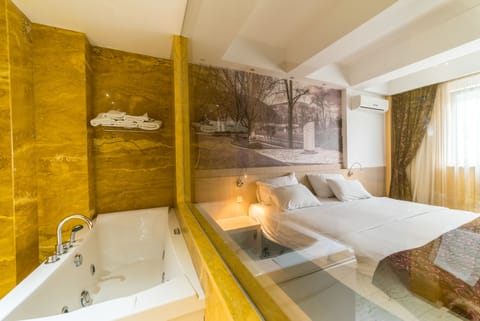 Presidential Suite, Jetted Tub, City View | Minibar, in-room safe, desk, soundproofing