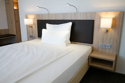 Comfort Double Room | Premium bedding, in-room safe, desk, soundproofing