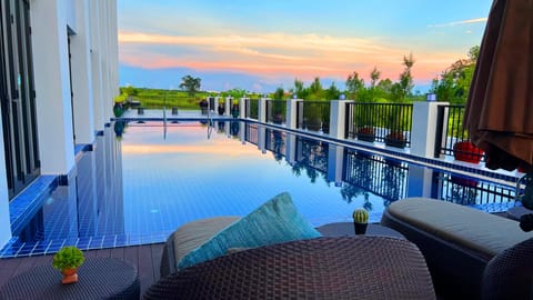 Outdoor pool, open 6:00 AM to 9:00 PM, sun loungers