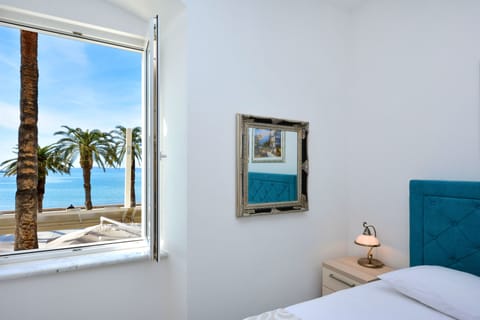 Deluxe Room, Sea View | Minibar, desk, free WiFi