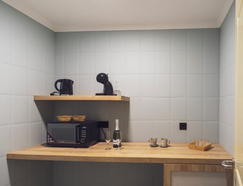 Mini-fridge, microwave, coffee/tea maker, electric kettle