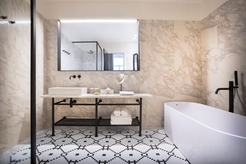 Grand Piazza | Bathroom | Shower, rainfall showerhead, designer toiletries, hair dryer