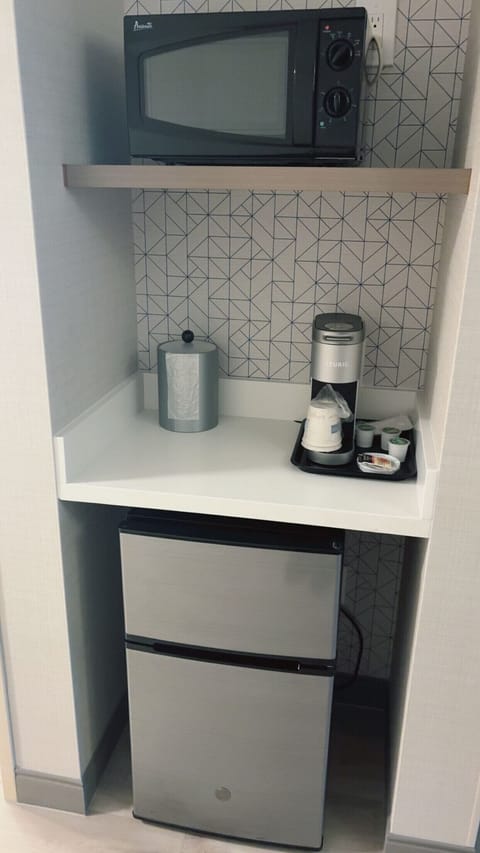 Desk, laptop workspace, blackout drapes, iron/ironing board