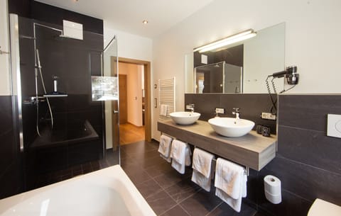 Apartment, 2 Bedrooms, Balcony (exkl. Final cleaning and city tax) | Bathroom amenities | Shower, rainfall showerhead, hair dryer, slippers