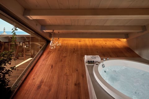 Grand Harbour Master Suite with Balcony and Sea View | Bathroom | Jetted tub, rainfall showerhead, designer toiletries, hair dryer