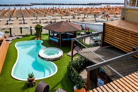 Seasonal outdoor pool, open 8:00 AM to 7:00 PM, sun loungers