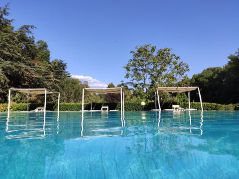 Seasonal outdoor pool, a rooftop pool, pool umbrellas, sun loungers
