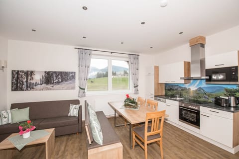 Comfort Apartment | Living area | Flat-screen TV