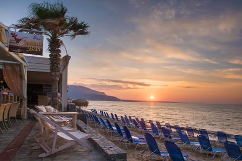 On the beach, sun loungers, beach umbrellas