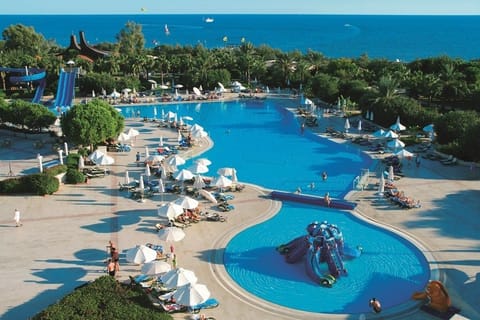 Indoor pool, seasonal outdoor pool, pool umbrellas, sun loungers