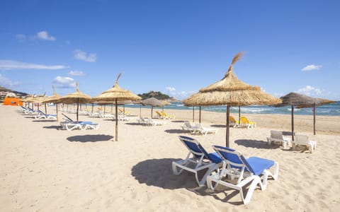 Private beach, white sand, sun loungers, beach umbrellas