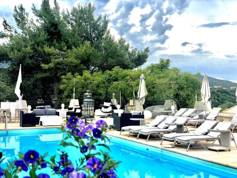 Seasonal outdoor pool, open 9:00 AM to 9:00 PM, pool umbrellas